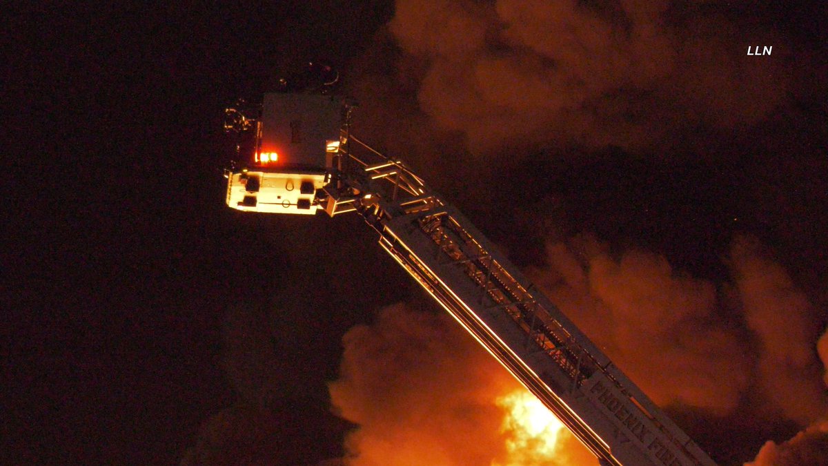 The fire is now heavily knocked down here at the 2nd alarm railroad tie fire. Crews are continuing to work on hot spots. I-10 has been re-opened in both directions