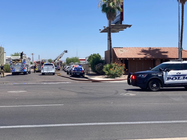 Fire officials investigating fire near Southern Ave/Mesa Dr. Ammo, other hazardous materials were exploding inside container on fire. Police helped evacuate those inside the business. No injuries were reported