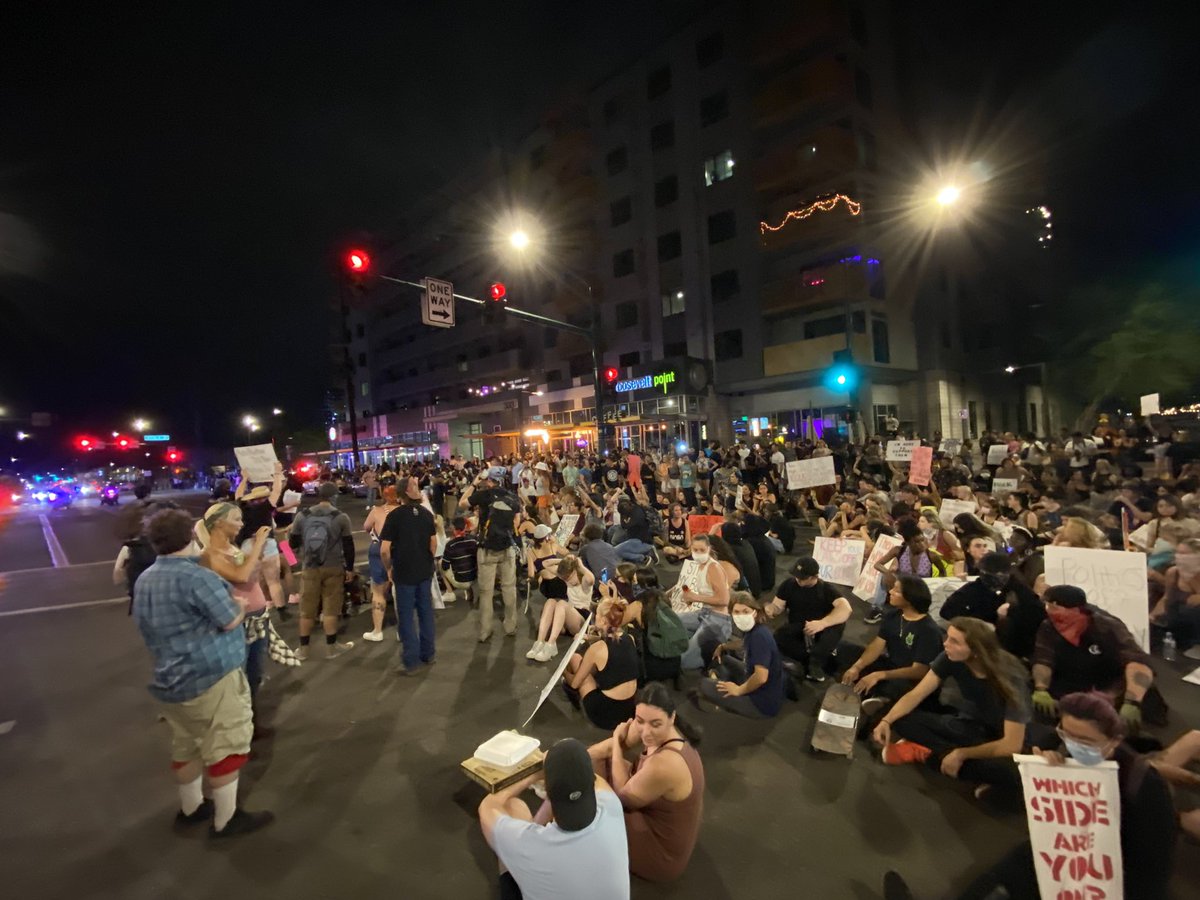 PHOENIX: Protesters are sitting in the intersection of 3rd St & Roosevelt. After marching from the Capitol. @PhoenixPolice diverting traffic around the area