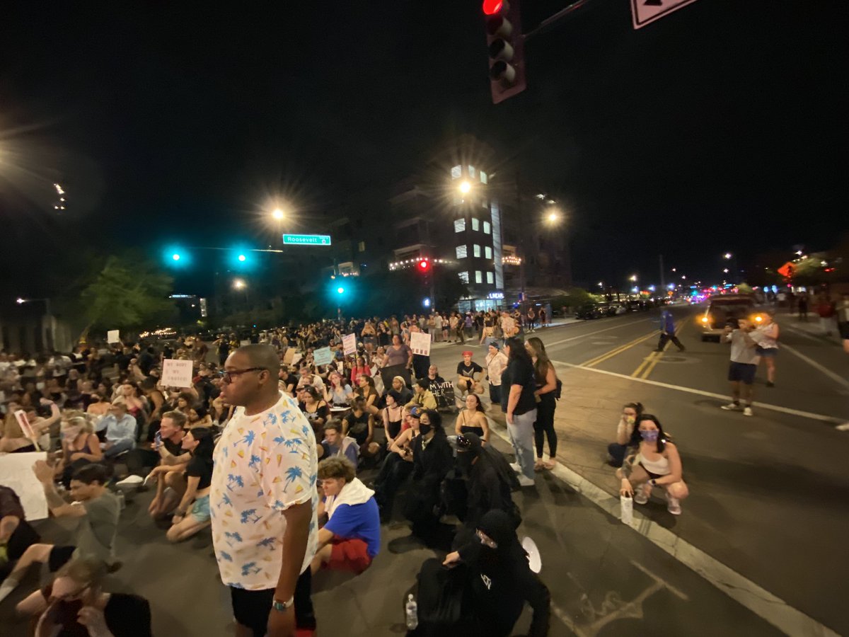 PHOENIX: Protesters are sitting in the intersection of 3rd St & Roosevelt. After marching from the Capitol. @PhoenixPolice diverting traffic around the area